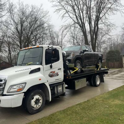 Professional Accident Recovery and Flatbed Towing: Protecting Your Investment